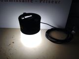 a light that is sitting on a table next to a box