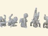 five figurines of angels on a white background