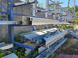 a pile of metal and wood on the side of a building