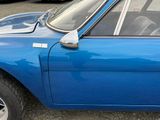 an image of a blue car parked on the side of the road