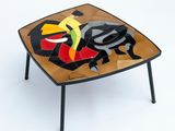 an image of a table with a mosaic design on top of it