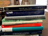 books stacked on top of each other on a table in a library