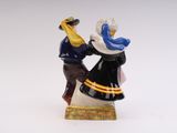 a figurine of a man and a woman dancing