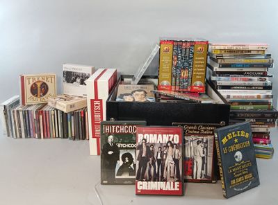 a lot of dvds and cds on the table