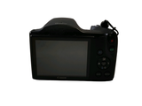 a digital camera that is sitting on a white surface