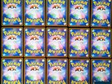 a close up of a bunch of pokemon cards on a table