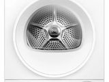a white dryer sitting on top of a dryer in front of a white wall