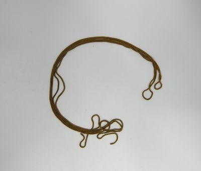 a close up of a piece of rope on a white surface