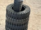 tires stacked on top of each other in a parking lot
