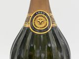 an image of a bottle of champagne sitting on top of a table