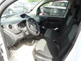 the interior of a car with the door open and the driver ' s seat down