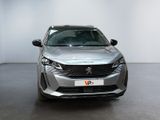 the front view of a silver car parked in a white room