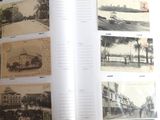 an open book with a bunch of old photos on it
