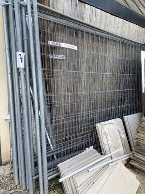 a fence that has a bunch of windows in it