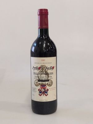 a bottle of wine that is sitting on a table