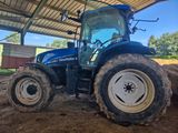 a tractor that is parked in the dirt