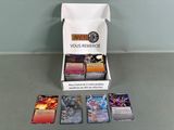 a box of cards sitting on a table next to a box of cards