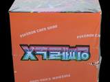 a box of pokemon cards sitting on a table
