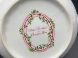 a close up of a white bowl with a pink rim