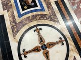a marble table with a cross on it in a room