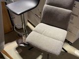 a chair that is sitting next to a desk