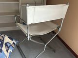 a chair that is sitting in the corner of a room