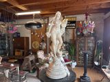 a statue of a man and a woman in a room