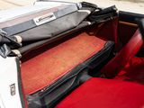 a suitcase sitting on top of the back seat of a car