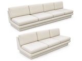 two white couches sitting next to each other on a white surface