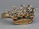 a gold ring with a crown on top of it