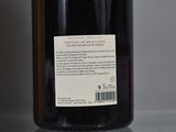 a bottle of wine that is sitting on a table