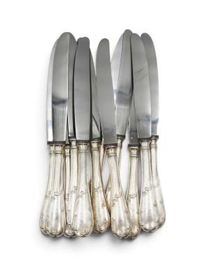 a set of five silverplated knives with a silver handle