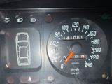 a close up of a dashboard with a car on it