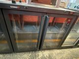 two glass doors that are open in a store
