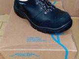 the box is full of a pair of black hiking shoes