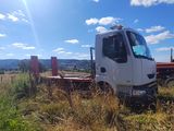 a white truck that is parked in the grass