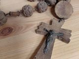 a wooden rosary with a cross on it on a table