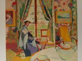 une photo d'un tableau représentant une femme assise à une table