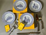 three plates and two silverwares on a table