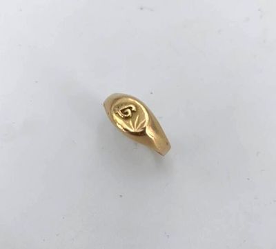 an image of a gold ring with the letter r on it