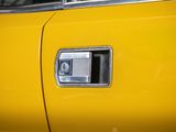 the door handle of a yellow car is open and there is no image on it