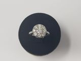 an image of a diamond ring on a black ring holder