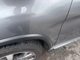 a close up of a car ' s tire with a hole in the side