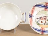 a bowl and a plate sitting on a table