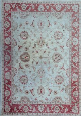 a red and white rug with a floral design on it