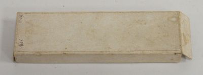 a small box that has a piece of paper on it