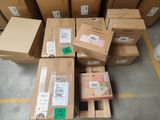 several boxes are stacked on top of each other in a warehouse