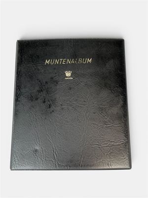a black book with a gold crown on top of it