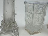 three glass vases sitting next to each other on a table
