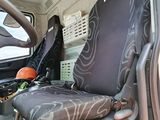 a seat in the back of a vehicle with a basketball ball in it